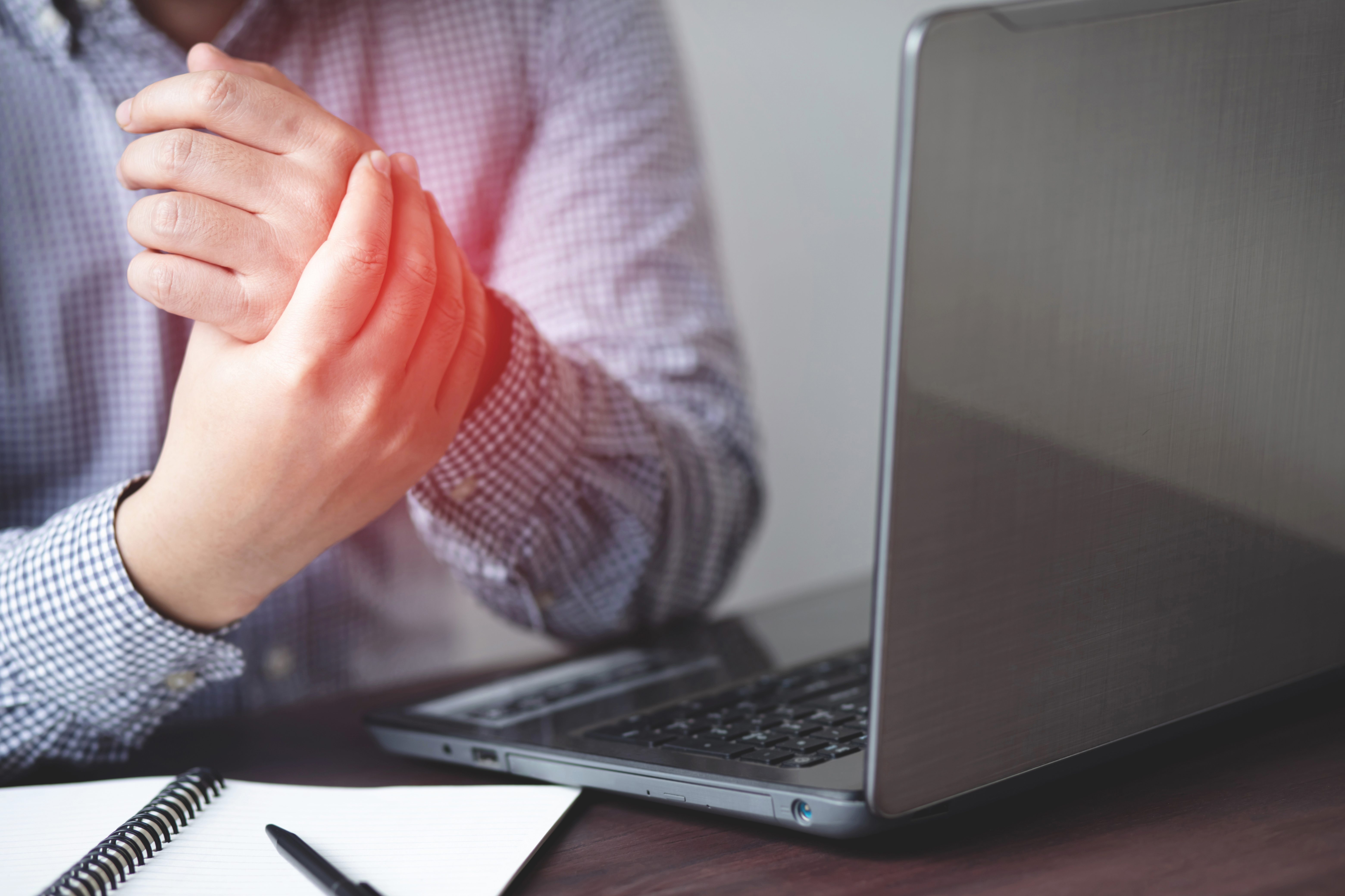 Man suffering from hand pain, bone pain
